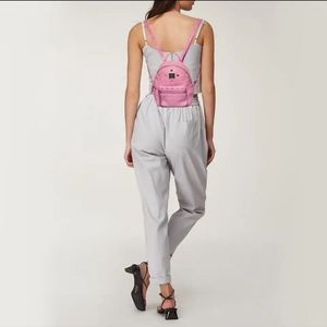 MCM bebe x mini stark studded backpack pink